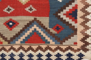 This antique kilim from the Qashqai tribe is woven from very finely spun and carded wool, thus creating a kilim of great precision. The center field has an "abrash" with spectacular color  ...