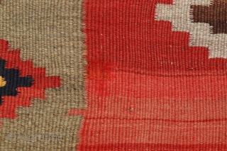 This antique kilim from the Qashqai tribe is woven from very finely spun and carded wool, thus creating a kilim of great precision. The center field has an "abrash" with spectacular color  ...