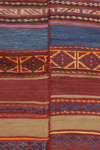 A stunning Taimani Aimaq Baluch kilim kilim from Afghanistan, distinguished by its beautiful and varied colour palette. The colours are predominantly natural dyes, including a deep indigo blue, a rich pistachio green, ...