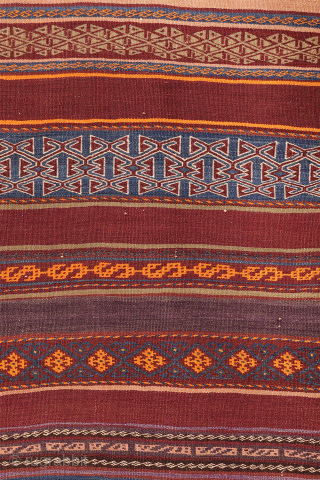 A stunning Taimani Aimaq Baluch kilim kilim from Afghanistan, distinguished by its beautiful and varied colour palette. The colours are predominantly natural dyes, including a deep indigo blue, a rich pistachio green, ...