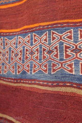 A stunning Taimani Aimaq Baluch kilim kilim from Afghanistan, distinguished by its beautiful and varied colour palette. The colours are predominantly natural dyes, including a deep indigo blue, a rich pistachio green, ...
