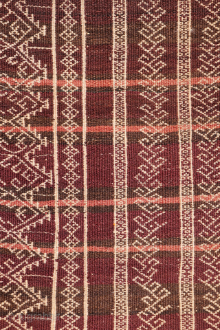 An earthy-toned (slightly aubergine hues) Serkhat Baluch Shaffi kilim with an exceptionally intricate pattern and refined drawing. The complexity of the design is achieved through the weaving of delicate linear motifs — ...