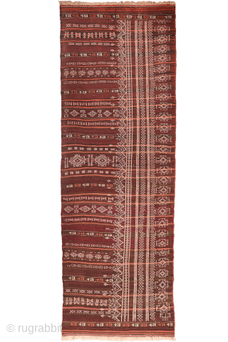An earthy-toned (slightly aubergine hues) Serkhat Baluch Shaffi kilim with an exceptionally intricate pattern and refined drawing. The complexity of the design is achieved through the weaving of delicate linear motifs — ...