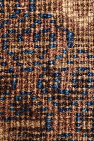 A very unusual Mushwani rug that carries the hooked design into the border. The rug has the traditional Mushwani design in natural colour indigo blue, terracotta and undyed white wool. Low overall  ...