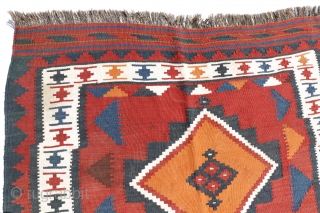 kilim from the Lori or Luri tribe of Iran. This kilim stands out for the three large medallions that occupy the entire central field. All dyes are natural. The weft, as seen  ...