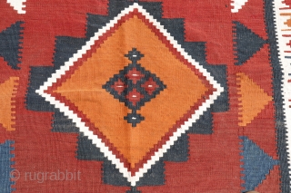 kilim from the Lori or Luri tribe of Iran. This kilim stands out for the three large medallions that occupy the entire central field. All dyes are natural. The weft, as seen  ...