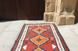 kilim from the Lori or Luri tribe of Iran. This kilim stands out for the three large medallions that occupy the entire central field. All dyes are natural. The weft, as seen  ...