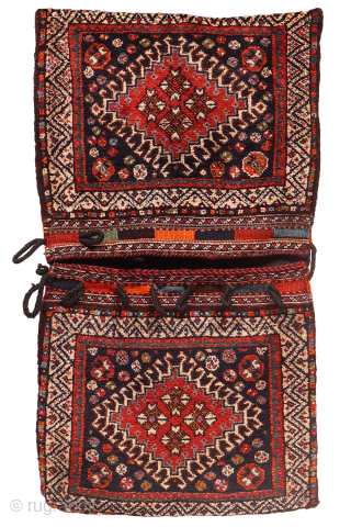 antique Luri saddlebag, or khorjin, a truly captivating piece. The main medallion boldly fills the entire front surface, featuring a pile that is wonderfully soft, plush, and long.

While many saddlebags typically showcase  ...