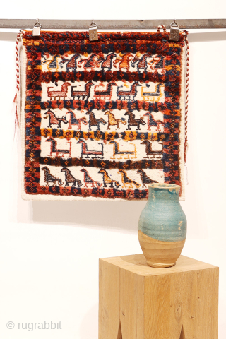 Enjoy this large and truly authentic chanteh, or tribal bag, a piece that feels untouched by commercial circuits. Woven with a white cotton warp and weft, it’s vibrantly decorated with a array  ...