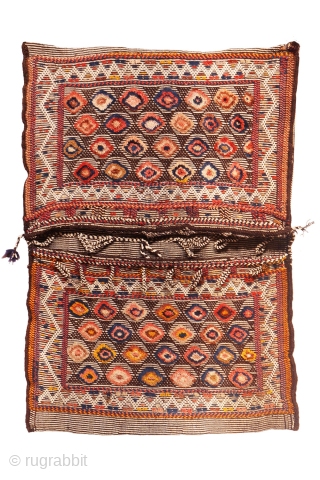 Are you searching for a truly unusual and original saddlebag? Look no further.

The captivating design of this antique Qashqai saddlebag was achieved using the warp-float weave technique. This specialized method is typically  ...