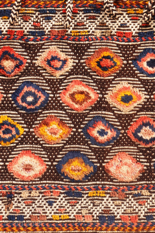 Are you searching for a truly unusual and original saddlebag? Look no further.

The captivating design of this antique Qashqai saddlebag was achieved using the warp-float weave technique. This specialized method is typically  ...