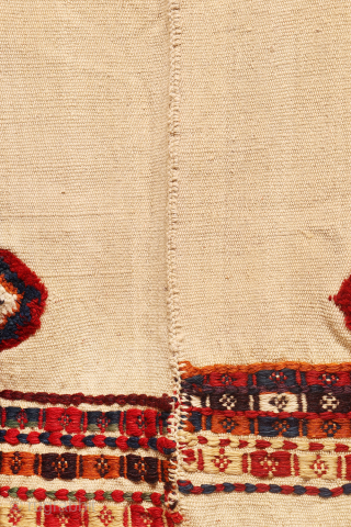 antique Qashqai jol, or horse blanket. Woven with an undyed wool background in a natural ivory hue, its simplicity highlights the artistry within.

Embracing the organic beauty of imperfection, the weaver introduced knotted  ...