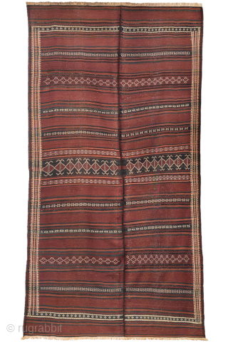 A beautiful antique Baluch kilim woven with finely hand-spun wool. This exceptionally dark antique kilim is difficult to photograph, and the images do not fully capture the richness of its natural colours ...