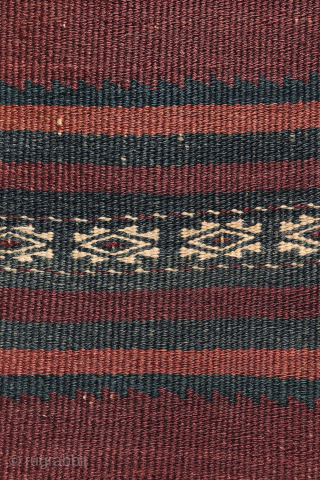 A beautiful antique Baluch kilim woven with finely hand-spun wool. This exceptionally dark antique kilim is difficult to photograph, and the images do not fully capture the richness of its natural colours ...