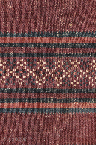 A beautiful antique Baluch kilim woven with finely hand-spun wool. This exceptionally dark antique kilim is difficult to photograph, and the images do not fully capture the richness of its natural colours ...