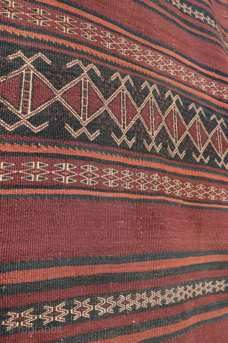 A beautiful antique Baluch kilim woven with finely hand-spun wool. This exceptionally dark antique kilim is difficult to photograph, and the images do not fully capture the richness of its natural colours ...
