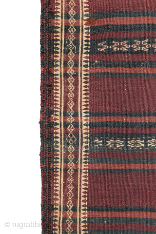 A beautiful antique Baluch kilim woven with finely hand-spun wool. This exceptionally dark antique kilim is difficult to photograph, and the images do not fully capture the richness of its natural colours ...