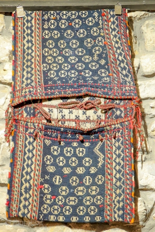 The weaver of this saddlebag from the Qashqai, was very creative when designing the saddlebag, particularly the backside of it. Woven with warp float weave technique. Natural dyes, some stains and repairs.
Material:  ...