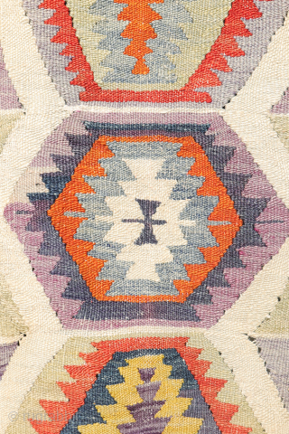 Early 20th-Century Sutlegen Kilim – Anatolia

Antique kilim from Suteglen, dating from the early 20th century, is a stunning example of Anatolian village weaving. Its main design features three vertical columns of hexagons:  ...