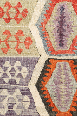 Early 20th-Century Sutlegen Kilim – Anatolia

Antique kilim from Suteglen, dating from the early 20th century, is a stunning example of Anatolian village weaving. Its main design features three vertical columns of hexagons:  ...
