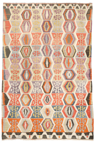 Early 20th-Century Sutlegen Kilim – Anatolia

Antique kilim from Suteglen, dating from the early 20th century, is a stunning example of Anatolian village weaving. Its main design features three vertical columns of hexagons:  ...
