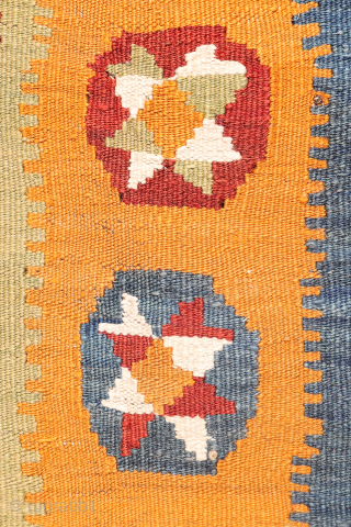 A superb antique Qashqai kilim showcasing a rich palette of natural colors. The background is dyed in what Persian weavers once called "copper" colour—a warm terracotta shade achieved with natural dyes. Upon  ...