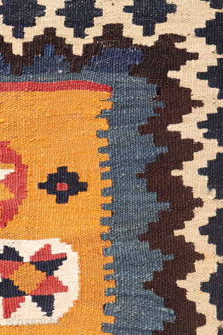 A superb antique Qashqai kilim showcasing a rich palette of natural colors. The background is dyed in what Persian weavers once called "copper" colour—a warm terracotta shade achieved with natural dyes. Upon  ...