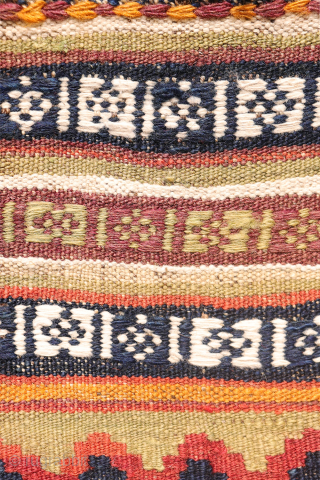 A superb antique Qashqai kilim showcasing a rich palette of natural colors. The background is dyed in what Persian weavers once called "copper" colour—a warm terracotta shade achieved with natural dyes. Upon  ...