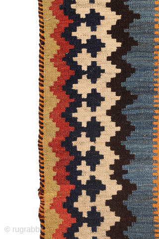 A superb antique Qashqai kilim showcasing a rich palette of natural colors. The background is dyed in what Persian weavers once called "copper" colour—a warm terracotta shade achieved with natural dyes. Upon  ...