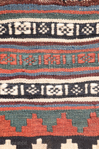 This antique Qashqai kilim is a striking example of tribal weaving, created with rich, naturally dyed colors that have retained their depth and vibrancy over time.

The main field features a bold deep-red  ...