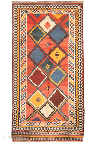 Antique Qashqai Kilim with gabbeh like Design.

This antique Qashqai kilim features a superb design brought to life with richly saturated natural dyes, including deep indigo blue, emerald green, and mustard tones. The  ...