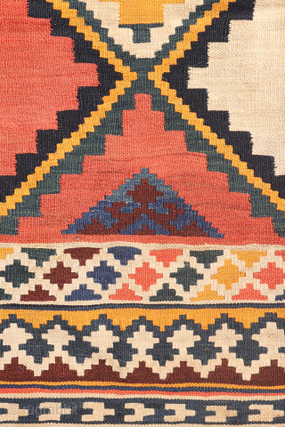 Antique Qashqai Kilim with gabbeh like Design.

This antique Qashqai kilim features a superb design brought to life with richly saturated natural dyes, including deep indigo blue, emerald green, and mustard tones. The  ...