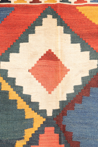 Antique Qashqai Kilim with gabbeh like Design.

This antique Qashqai kilim features a superb design brought to life with richly saturated natural dyes, including deep indigo blue, emerald green, and mustard tones. The  ...