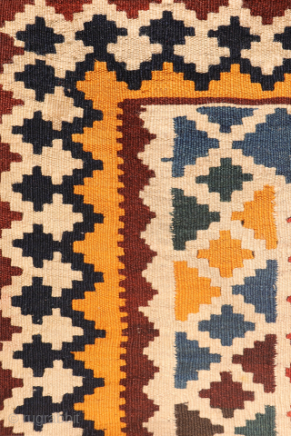 Antique Qashqai Kilim with gabbeh like Design.

This antique Qashqai kilim features a superb design brought to life with richly saturated natural dyes, including deep indigo blue, emerald green, and mustard tones. The  ...