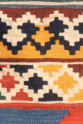 Antique Qashqai Kilim with gabbeh like Design.

This antique Qashqai kilim features a superb design brought to life with richly saturated natural dyes, including deep indigo blue, emerald green, and mustard tones. The  ...