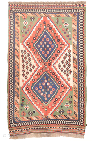 Antique Qashqai Kilim with and Unusual Green Palette

This antique Qashqai kilim follows traditional tribal patterns—but with a distinctive twist. While it retains the classic diamond medallion structure typical of Qashqai weaving, what  ...