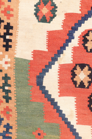 Antique Qashqai Kilim with and Unusual Green Palette

This antique Qashqai kilim follows traditional tribal patterns—but with a distinctive twist. While it retains the classic diamond medallion structure typical of Qashqai weaving, what  ...