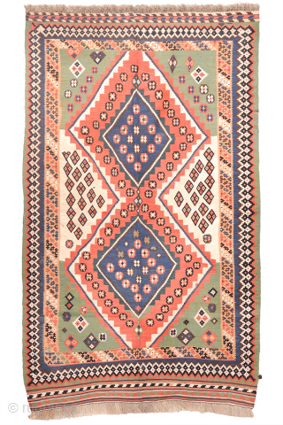 Antique Qashqai Kilim with and Unusual Green Palette

This antique Qashqai kilim follows traditional tribal patterns—but with a distinctive twist. While it retains the classic diamond medallion structure typical of Qashqai weaving, what  ...