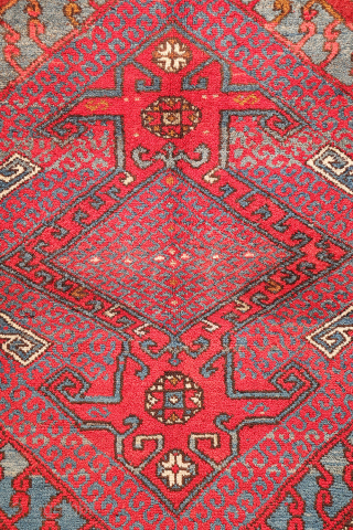 A wonderfully thick and plush antique Bergama rug, with a beautiful range of colours and an unmistakable village character. A deep indigo blue runs throughout the composition, brought to life by the  ...