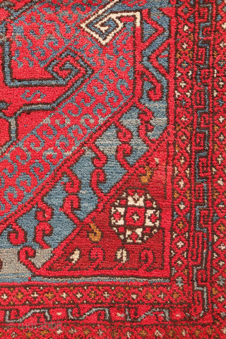 A wonderfully thick and plush antique Bergama rug, with a beautiful range of colours and an unmistakable village character. A deep indigo blue runs throughout the composition, brought to life by the  ...