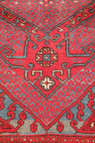 A wonderfully thick and plush antique Bergama rug, with a beautiful range of colours and an unmistakable village character. A deep indigo blue runs throughout the composition, brought to life by the  ...