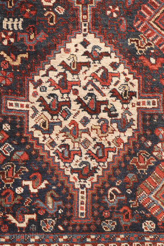 An antique Khamseh rug with a wonderful design and a very practical, almost square size.
The rug features two sets of medallions, each filled with numerous birds. These birds are repeated throughout the ...