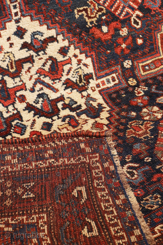 An antique Khamseh rug with a wonderful design and a very practical, almost square size.
The rug features two sets of medallions, each filled with numerous birds. These birds are repeated throughout the ...