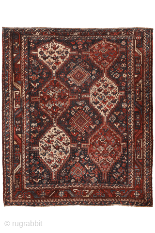 An antique Khamseh rug with a wonderful design and a very practical, almost square size.
The rug features two sets of medallions, each filled with numerous birds. These birds are repeated throughout the ...