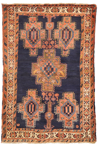 
The deep indigo-blue field provides the perfect backdrop for the four medallions, woven in soft pastel colours that contrast beautifully with the dark ground. Although the medallions are drawn in a highly  ...