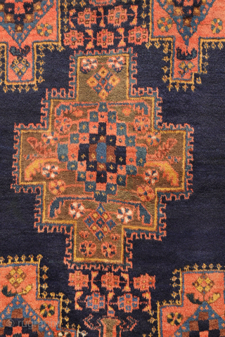 
The deep indigo-blue field provides the perfect backdrop for the four medallions, woven in soft pastel colours that contrast beautifully with the dark ground. Although the medallions are drawn in a highly  ...