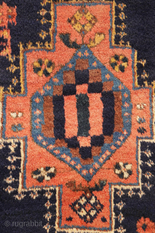 
The deep indigo-blue field provides the perfect backdrop for the four medallions, woven in soft pastel colours that contrast beautifully with the dark ground. Although the medallions are drawn in a highly  ...