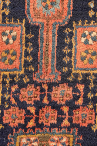 
The deep indigo-blue field provides the perfect backdrop for the four medallions, woven in soft pastel colours that contrast beautifully with the dark ground. Although the medallions are drawn in a highly  ...