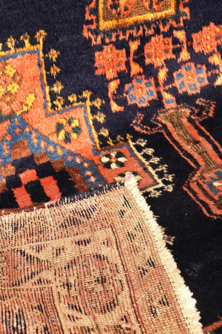 
The deep indigo-blue field provides the perfect backdrop for the four medallions, woven in soft pastel colours that contrast beautifully with the dark ground. Although the medallions are drawn in a highly  ...