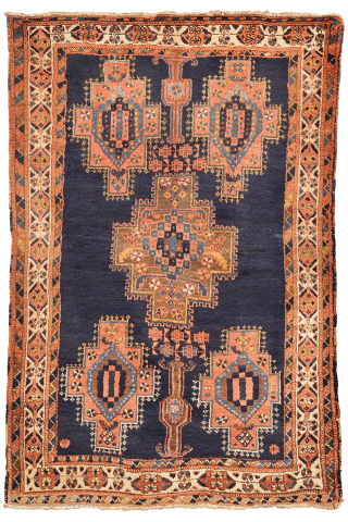 
The deep indigo-blue field provides the perfect backdrop for the four medallions, woven in soft pastel colours that contrast beautifully with the dark ground. Although the medallions are drawn in a highly  ...